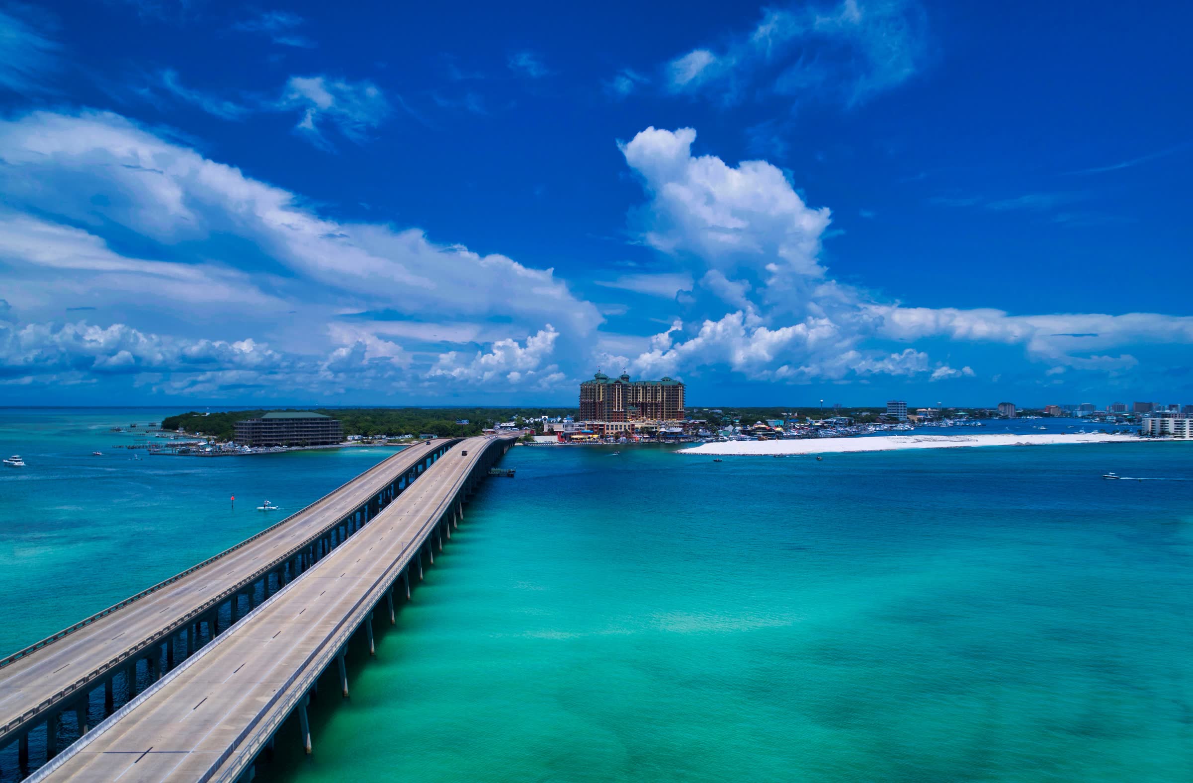 Boats running through Destin Pass on the Emerald Coast