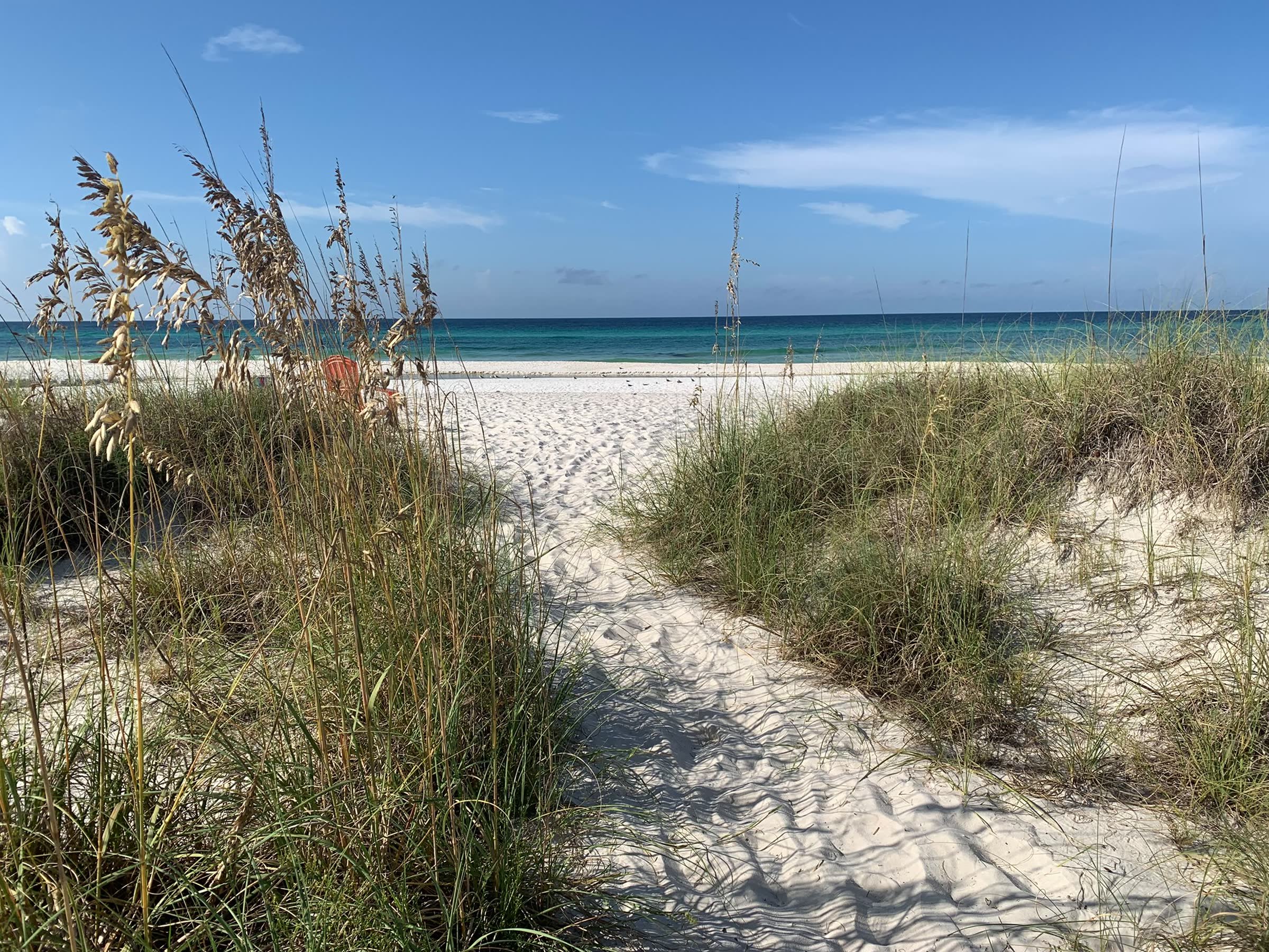 Emerald water and white sand along Panama City Beach